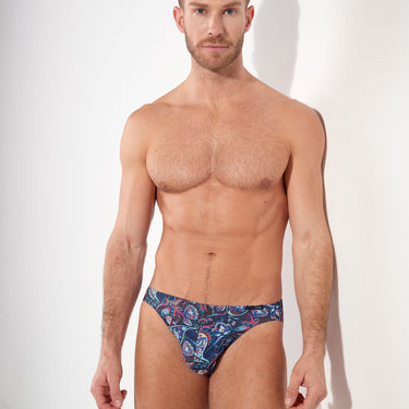Man wearing a patterned underwear on a white background